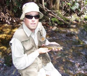 Matt Campbell holds up one of a stack of small brown trout he caught up the Tanjil on dry fly.